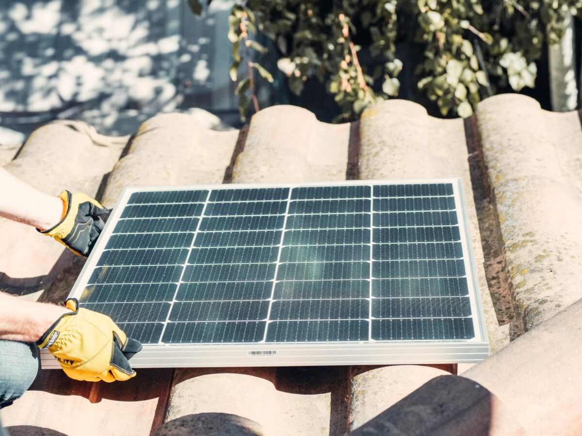 black solar panel on brown rock